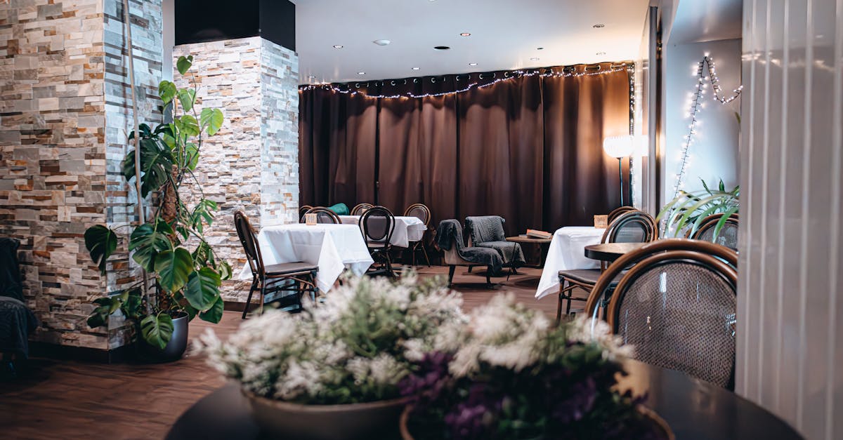 A cosy bistro interior with linen-topped tables and soft lighting