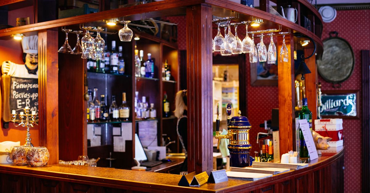 A warm, traditional British pub with beer taps along the bar